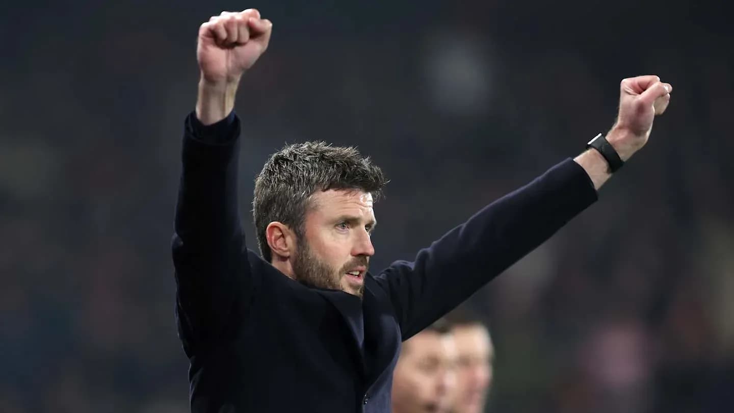 Coach celebrating with raised arms during match Coach celebrating with raised arms during match