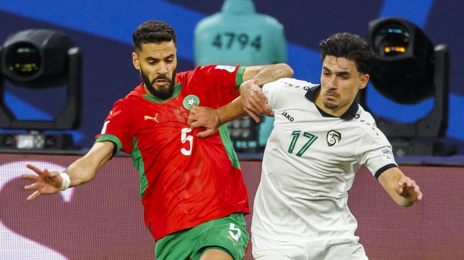 Two players battling for possession during a match Two players battling for possession during a match
