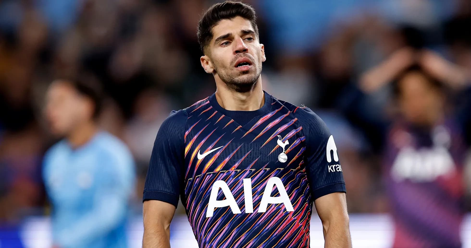Tottenham player looking down during a match Tottenham player looking down during a match