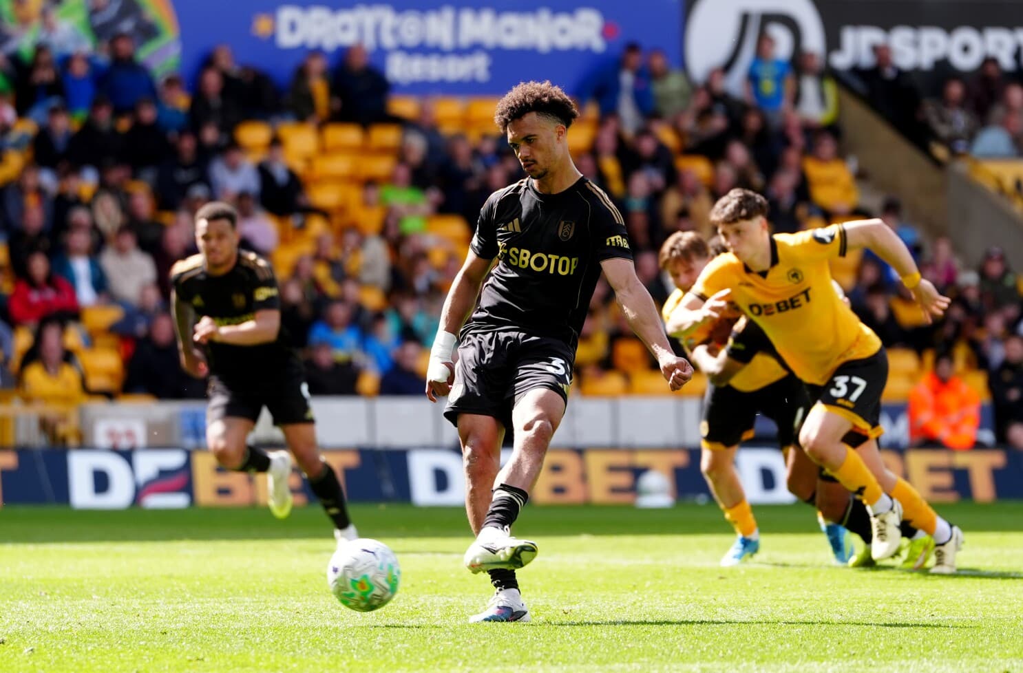 Player taking a penalty kick in football match Player taking a penalty kick in football match