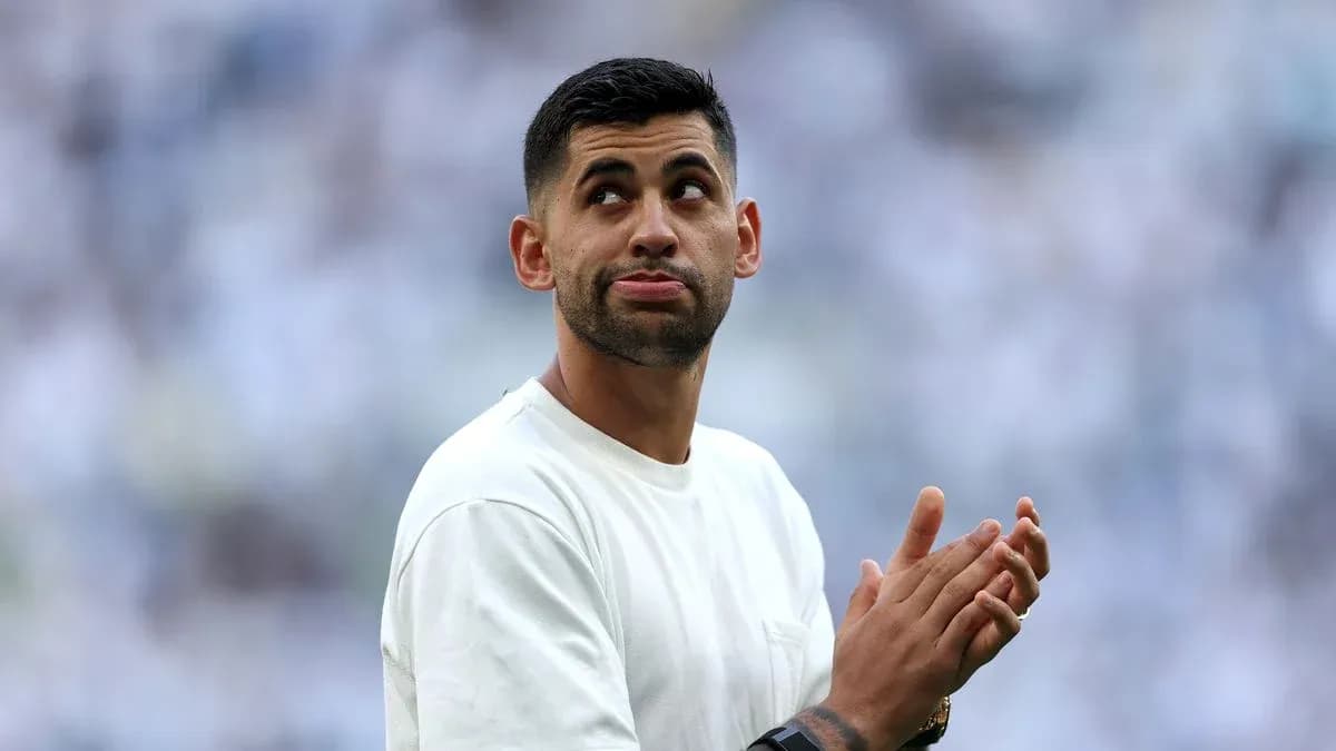 Player clapping during pre-match warm-up on field Player clapping during pre-match warm-up on field