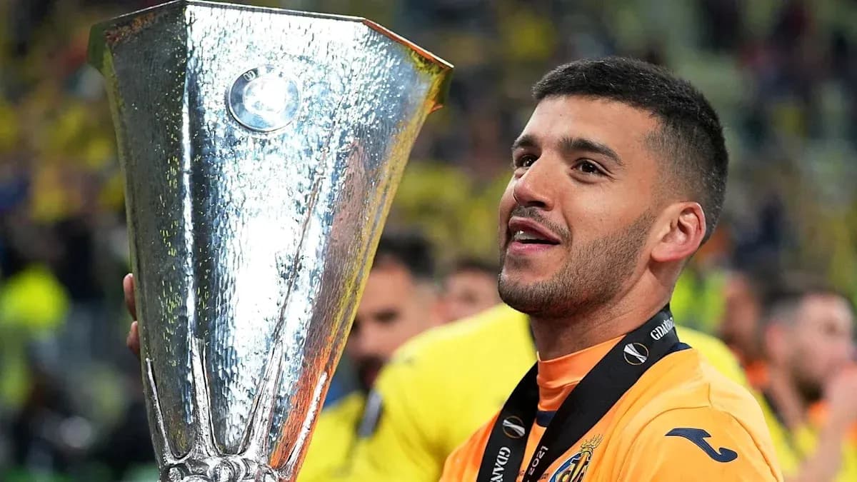 Player celebrating with UEFA Europa League trophy Player celebrating with UEFA Europa League trophy