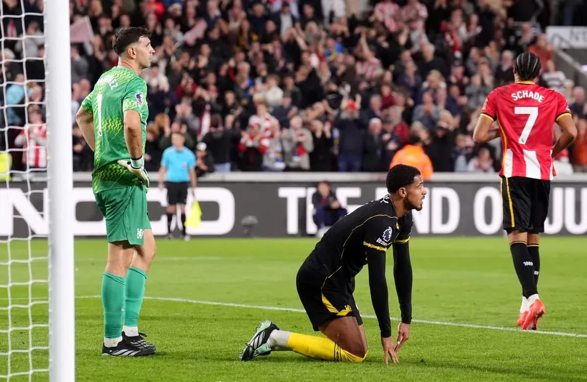 Goalkeeper and player reacting after conceding a goal Goalkeeper and player reacting after conceding a goal