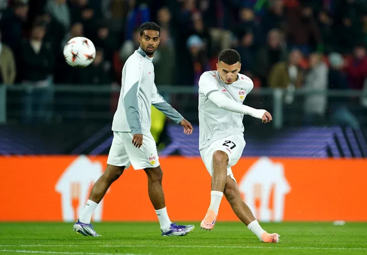 Player kicking ball during warm-up session Player kicking ball during warm-up session