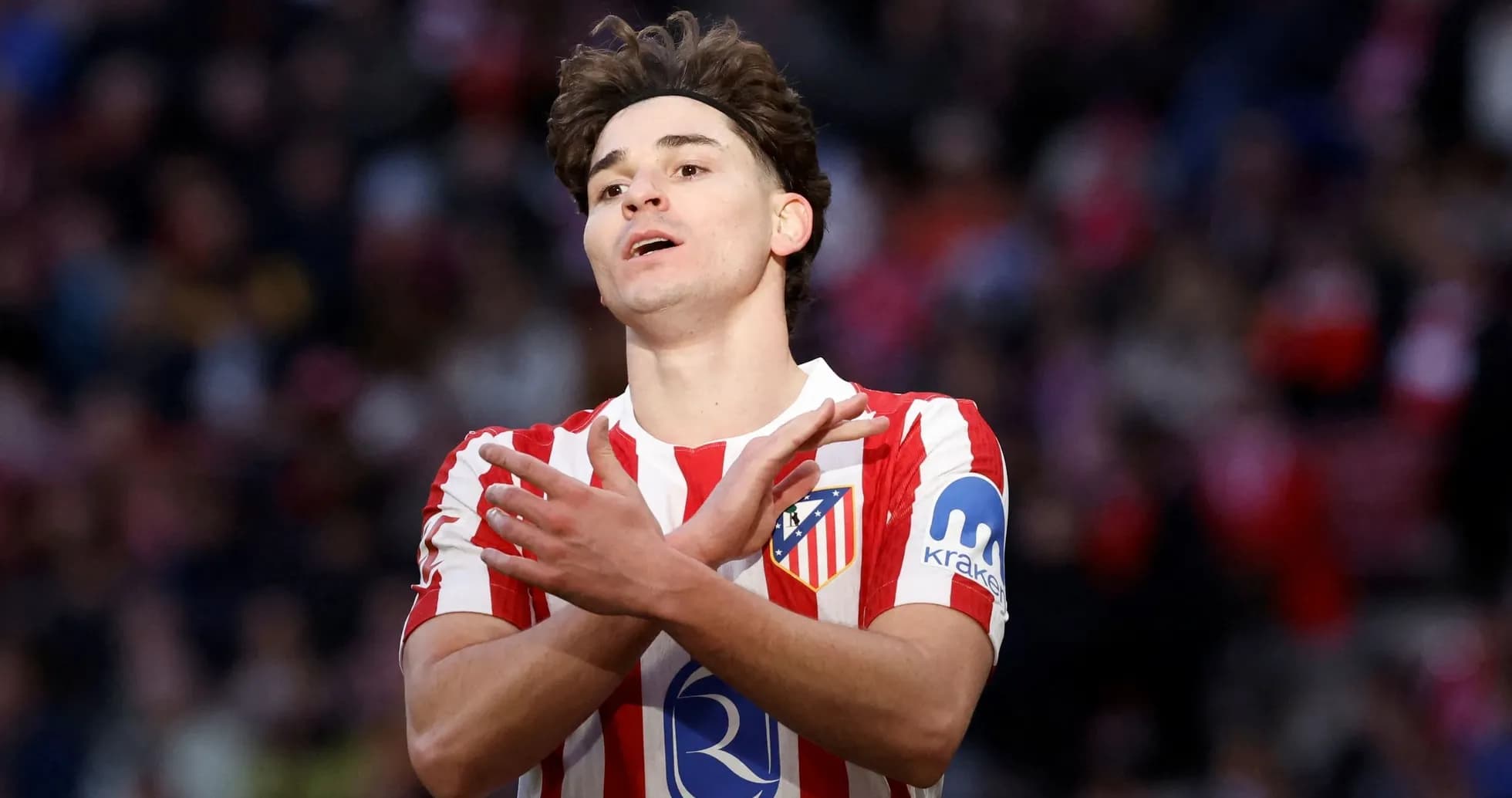 Atletico Madrid player gesturing during a match Atletico Madrid player gesturing during a match