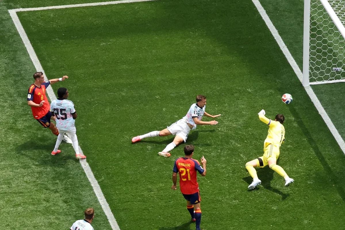 Goalkeeper diving to save a shot on goal Goalkeeper diving to save a shot on goal