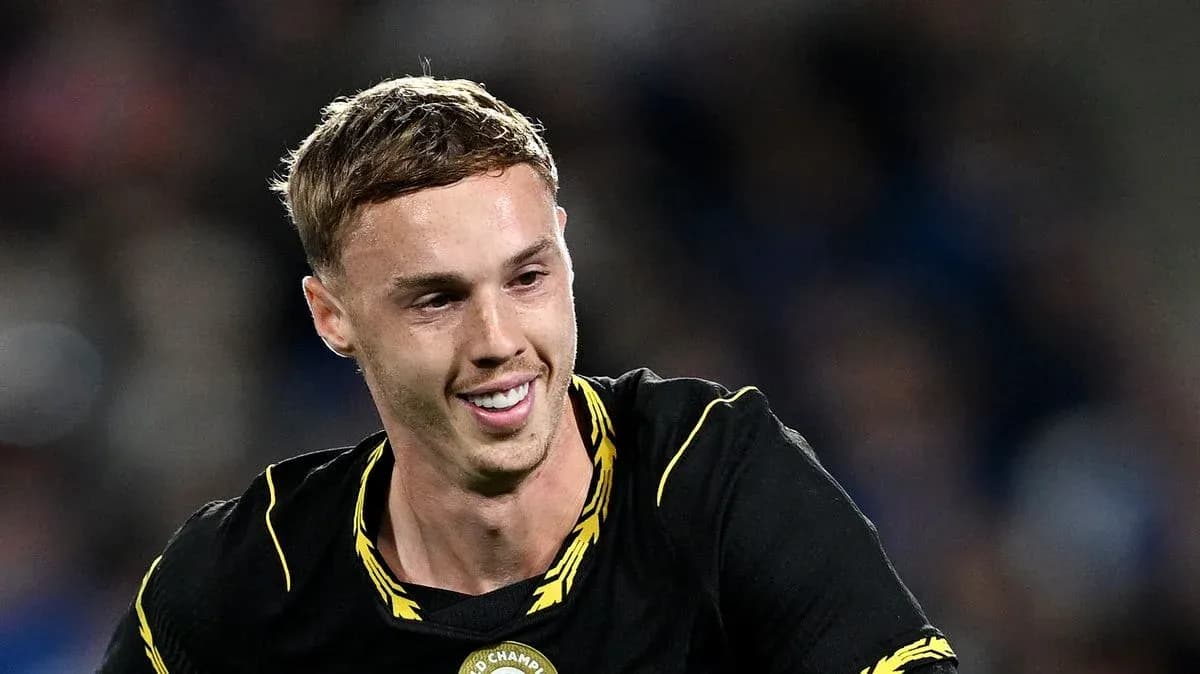 Player smiling during a football match celebration Player smiling during a football match celebration