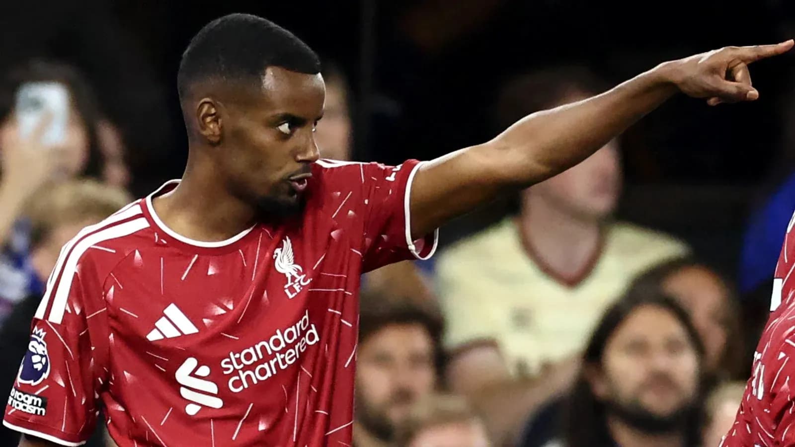 Player in Liverpool jersey gesturing during match Player in Liverpool jersey gesturing during match