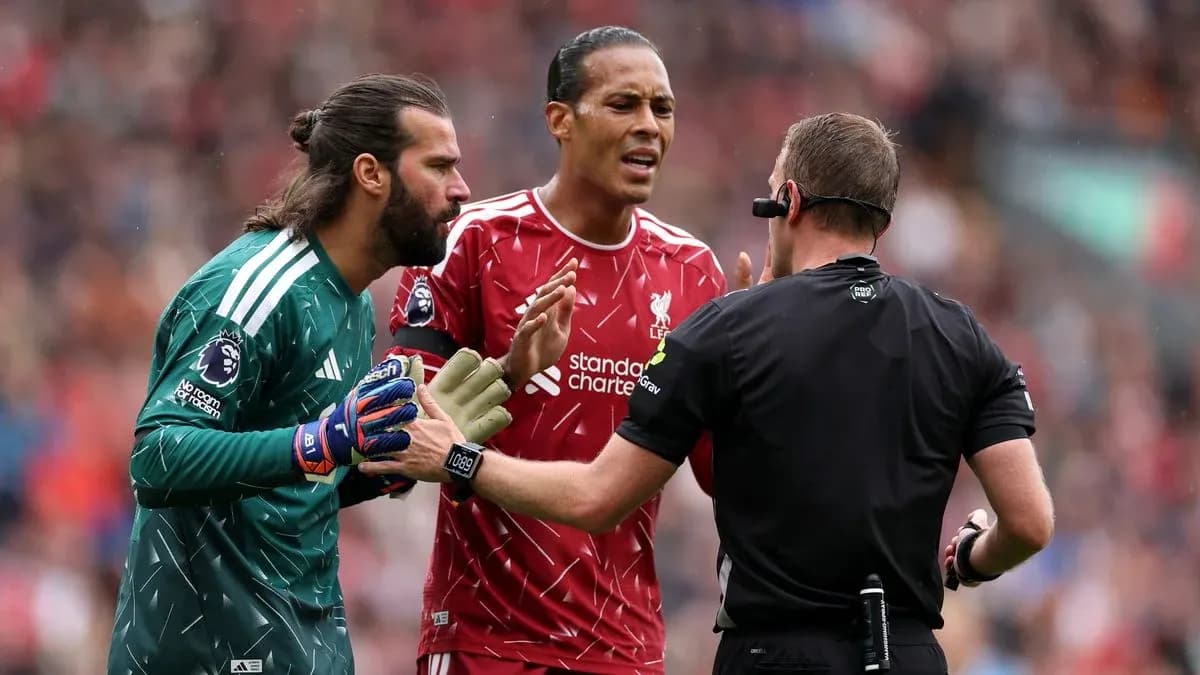 Liverpool players arguing with referee during match Liverpool players arguing with referee during match