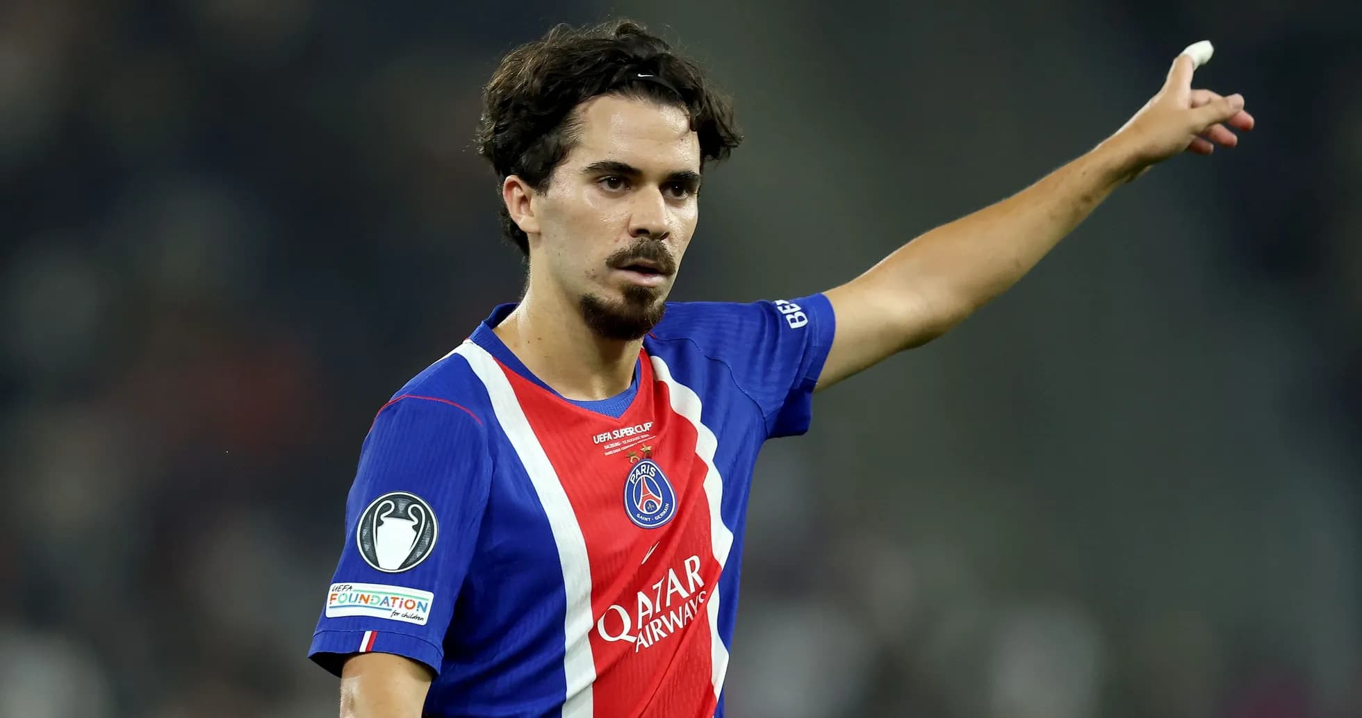 Player gesturing during a UEFA match Player gesturing during a UEFA match