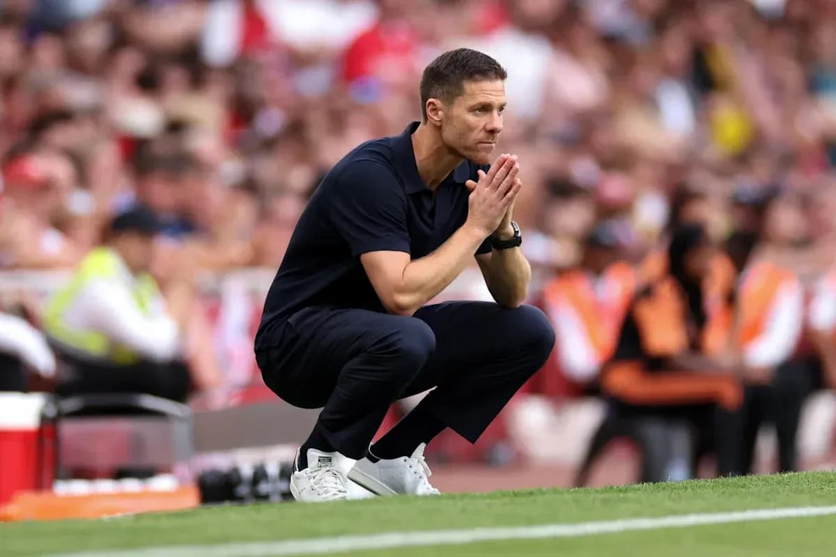 Coach squatting on the sideline during match Coach squatting on the sideline during match