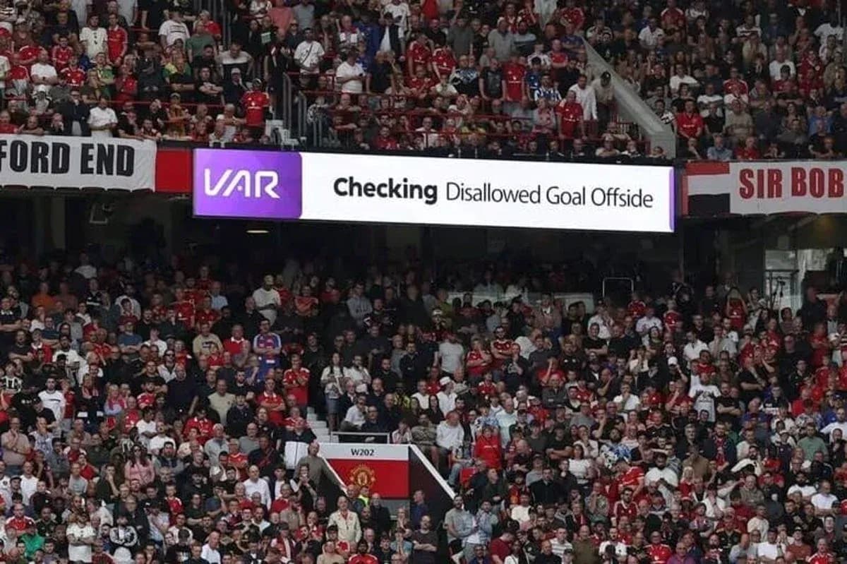 Crowd watching VAR decision for disallowed goal Crowd watching VAR decision for disallowed goal