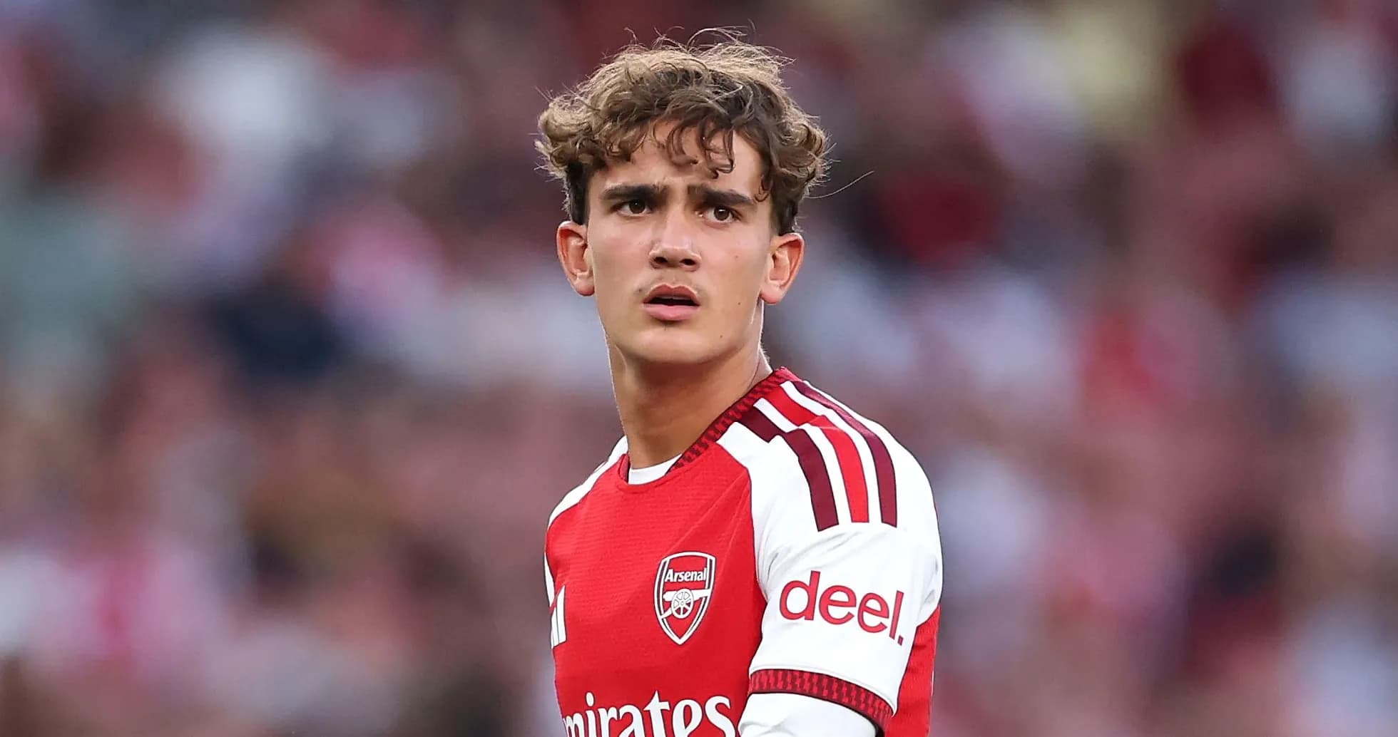 Young player in Arsenal jersey during match Young player in Arsenal jersey during match