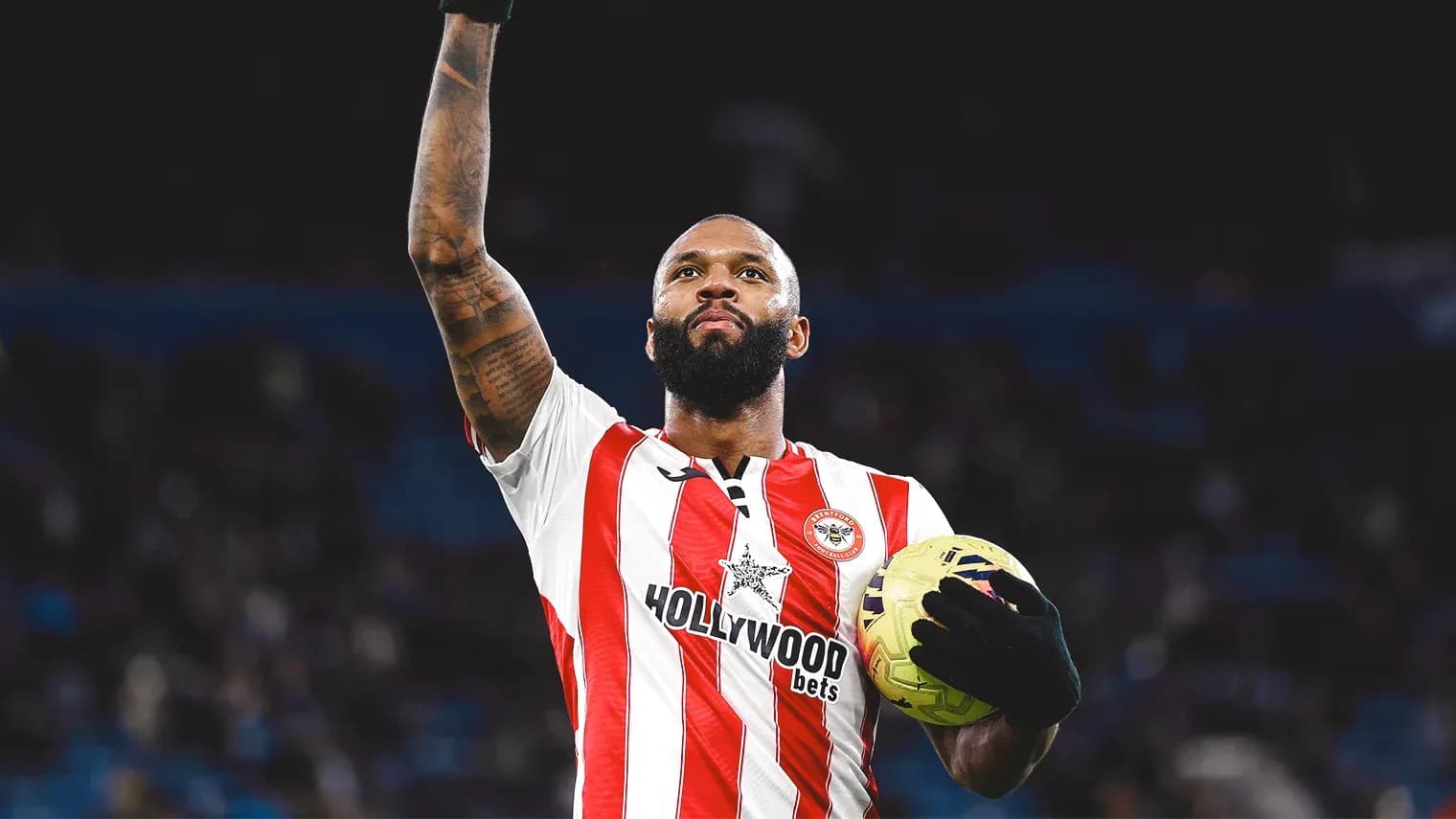 Brentford player celebrating with football Brentford player celebrating with football