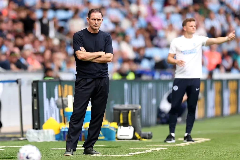 Two coaches on the sidelines during a match Two coaches on the sidelines during a match