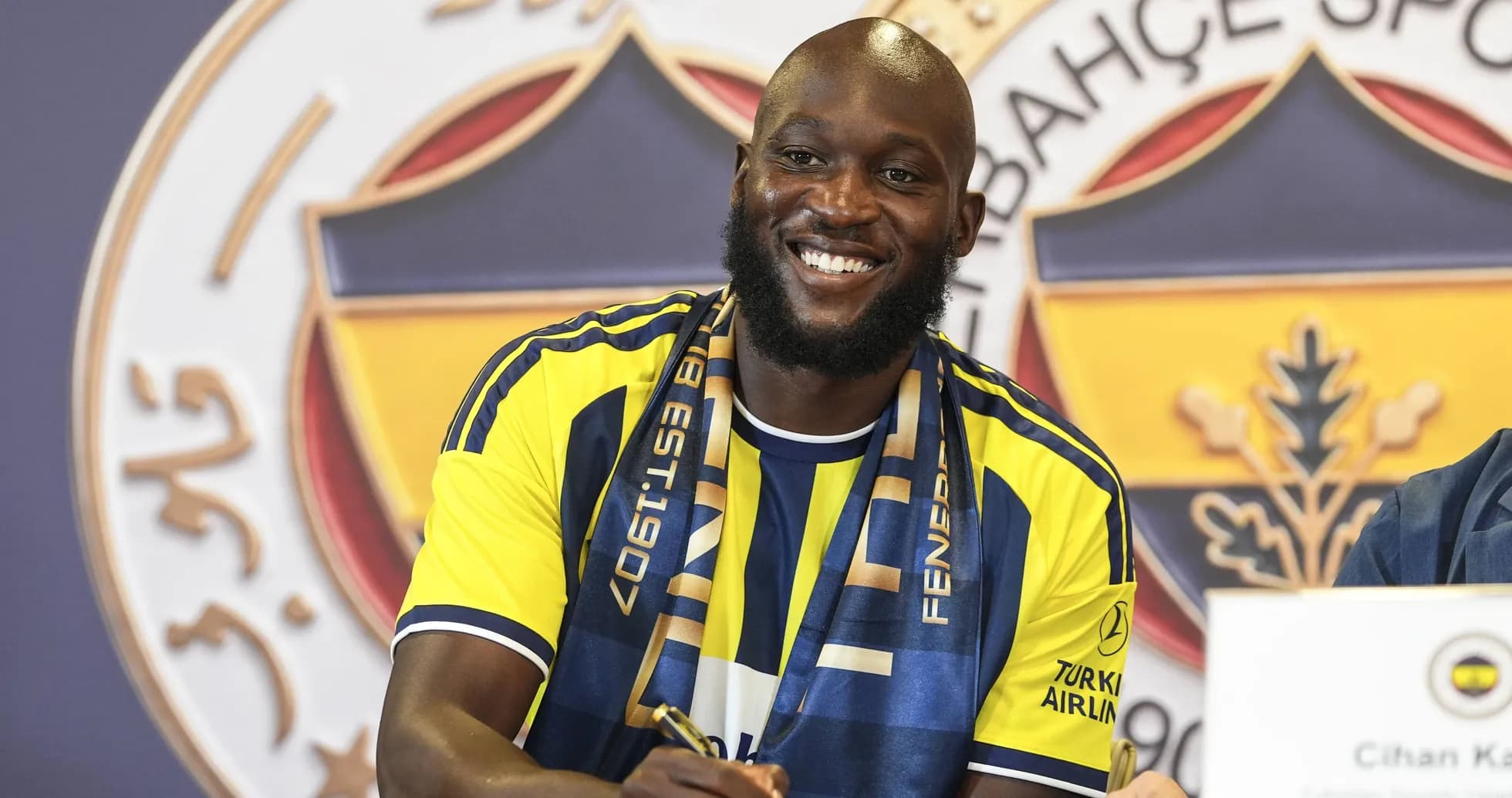 Player signing contract at Fenerbahçe press conference Player signing contract at Fenerbahçe press conference