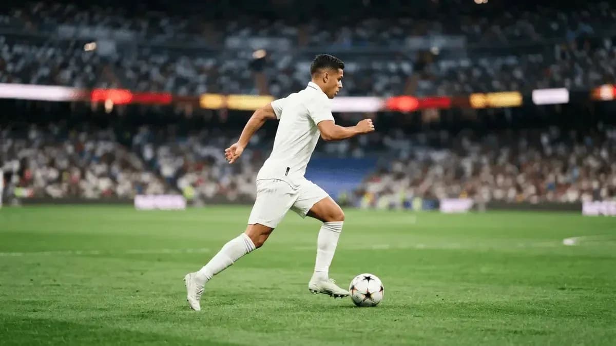 Player running with the ball on the pitch Player running with the ball on the pitch