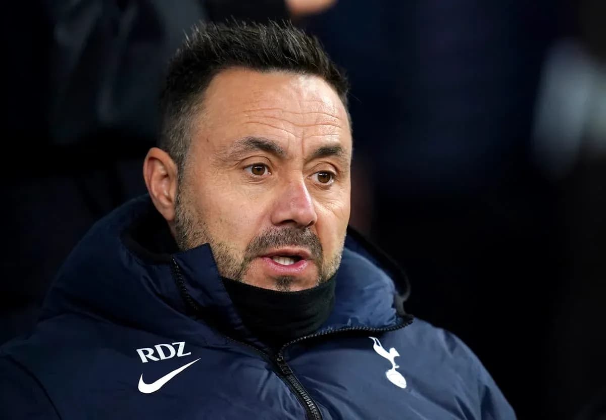 Coach in Tottenham jacket during match Coach in Tottenham jacket during match