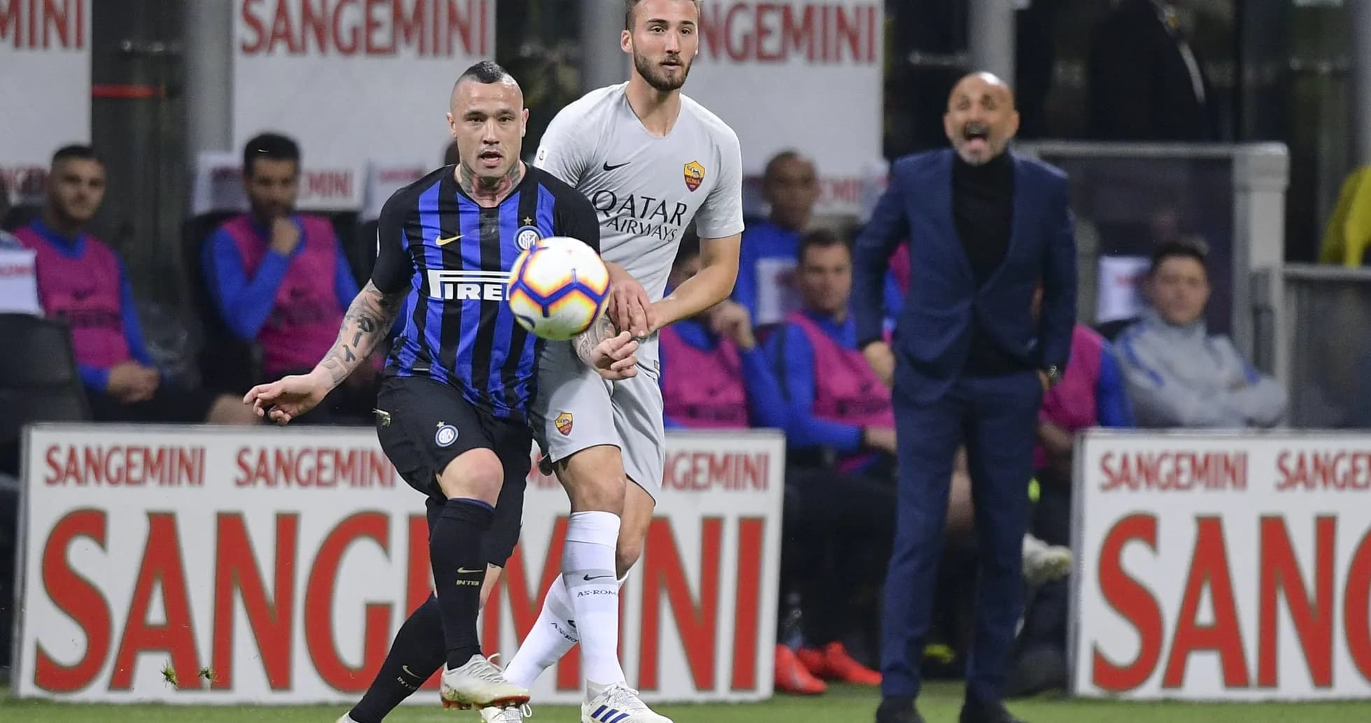 Players competing for the ball during Serie A match Players competing for the ball during Serie A match