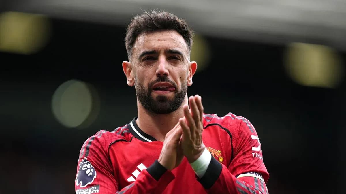 Player applauding fans in Manchester United kit Player applauding fans in Manchester United kit