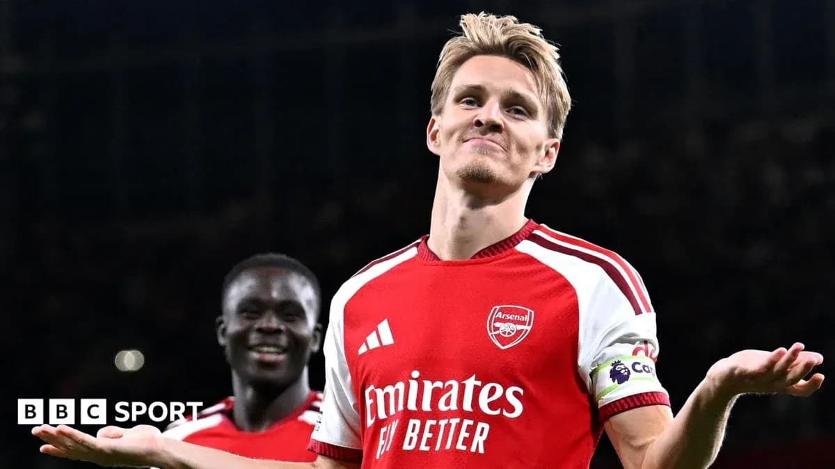 Arsenal player celebrating with teammate after goal Arsenal player celebrating with teammate after goal