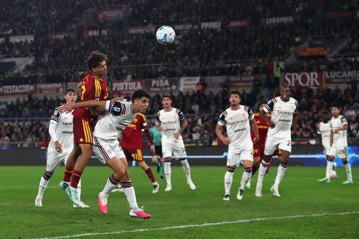 AS Roma player challenging Cagliari opponent for header AS Roma player challenging Cagliari opponent for header