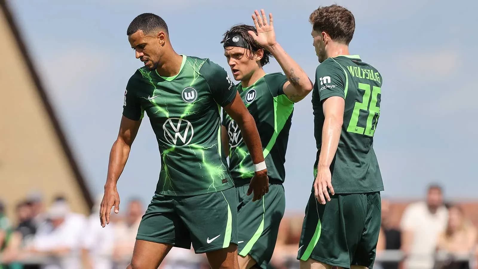 Wolfsburg players celebrating after a goal Wolfsburg players celebrating after a goal