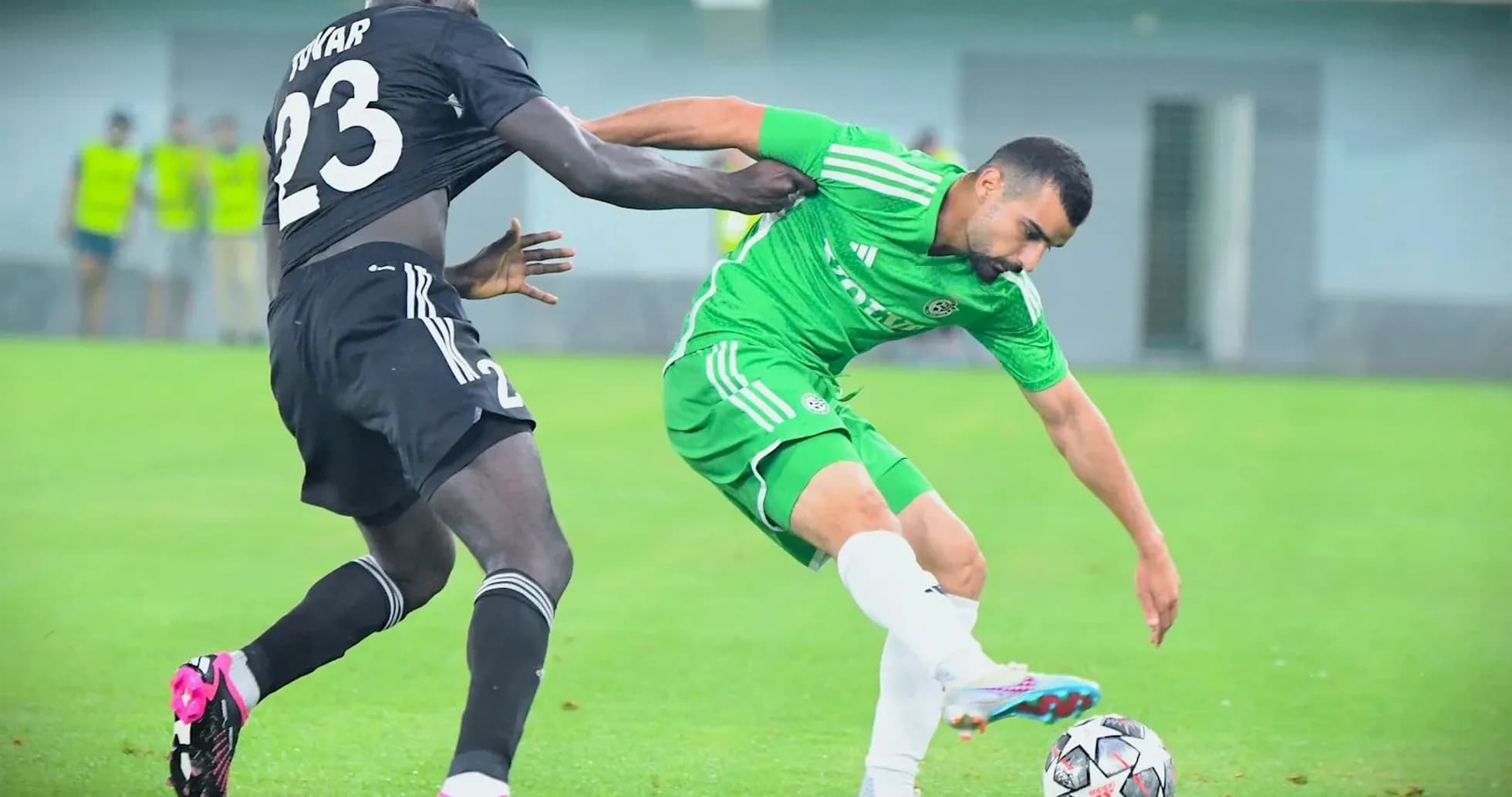 Player challenging for the ball during match Player challenging for the ball during match