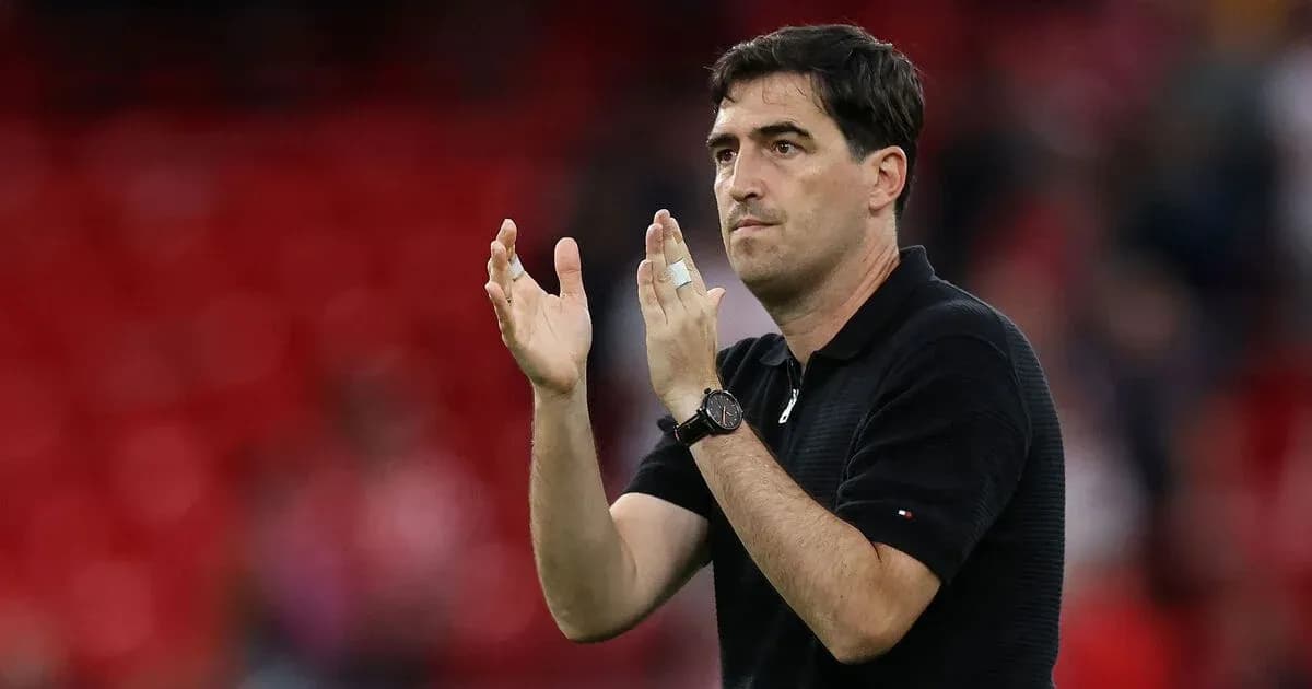 Coach clapping hands during match on field Coach clapping hands during match on field