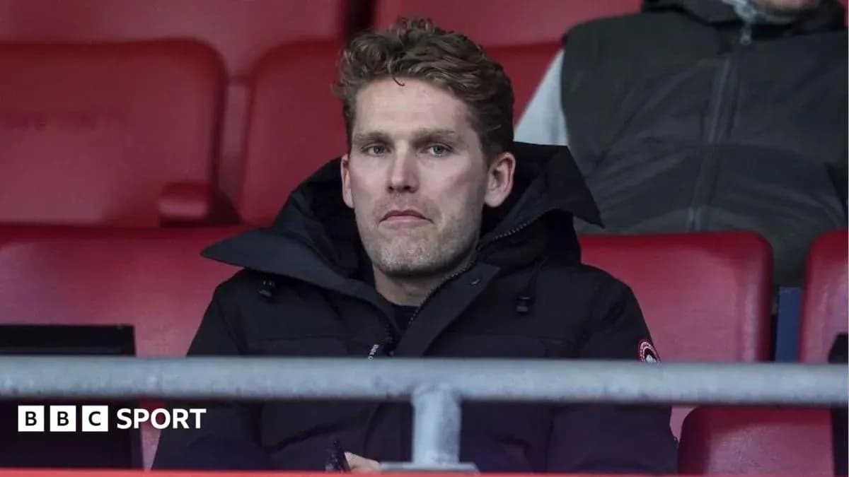 Man sitting in stadium stands during match Man sitting in stadium stands during match