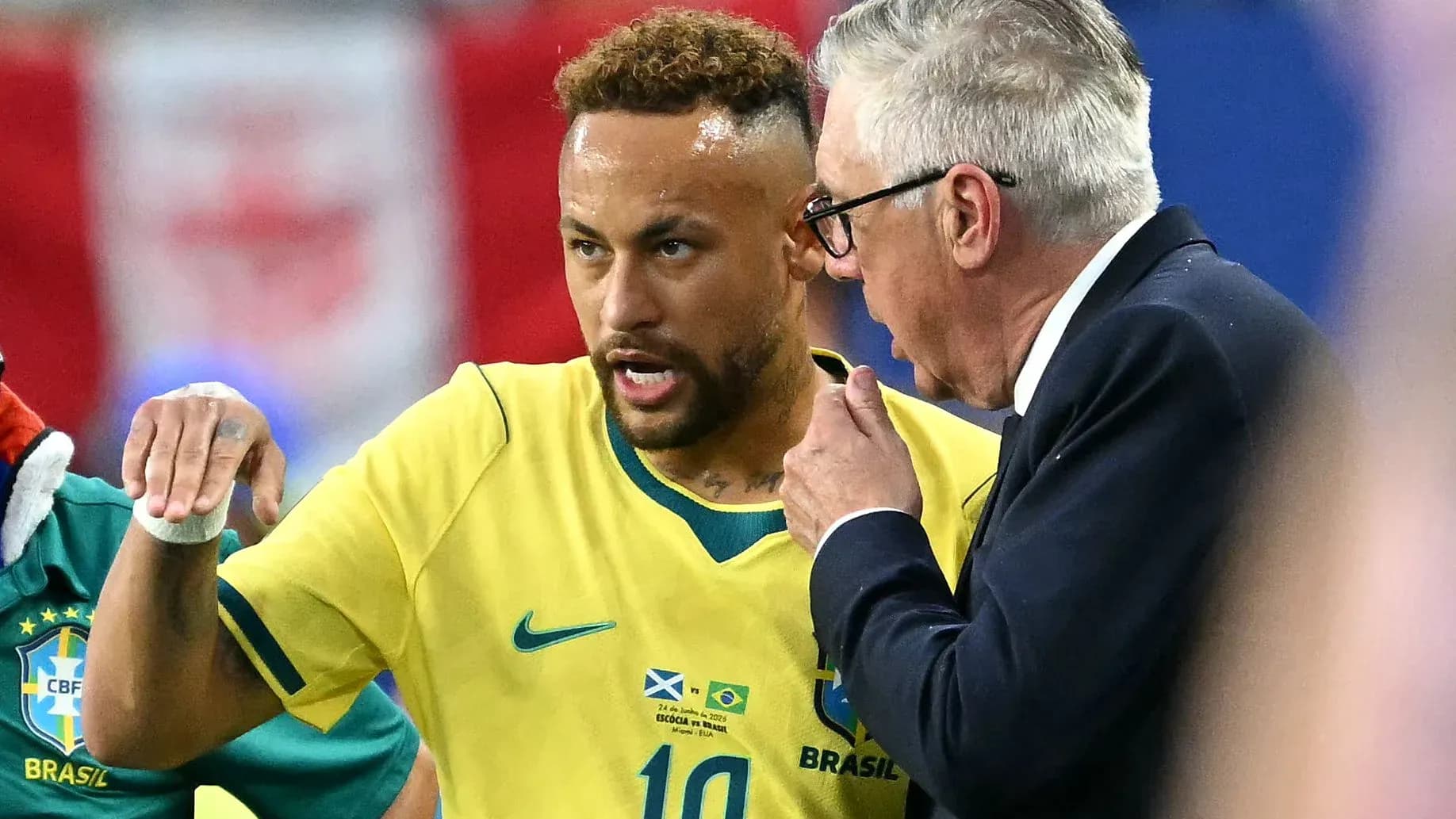 Neymar discussing tactics with coach during match Neymar discussing tactics with coach during match