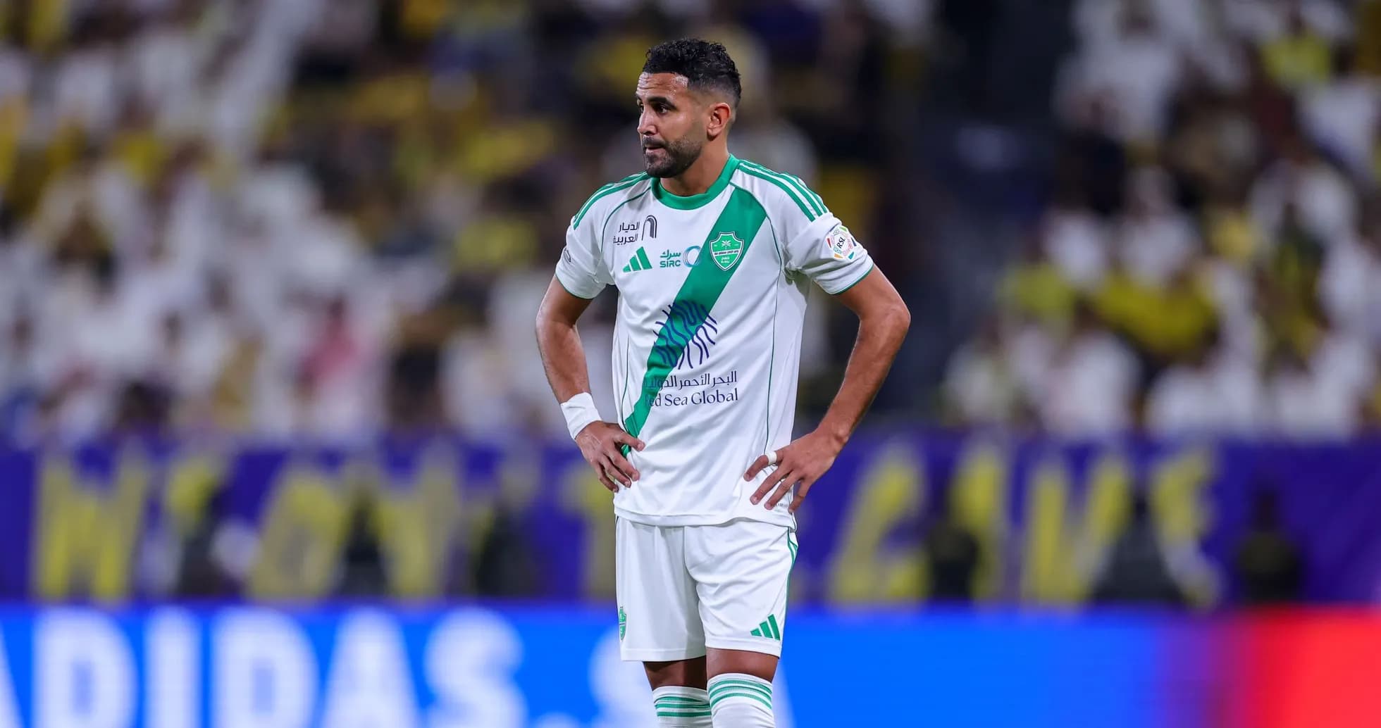 Player in green and white kit during match Player in green and white kit during match