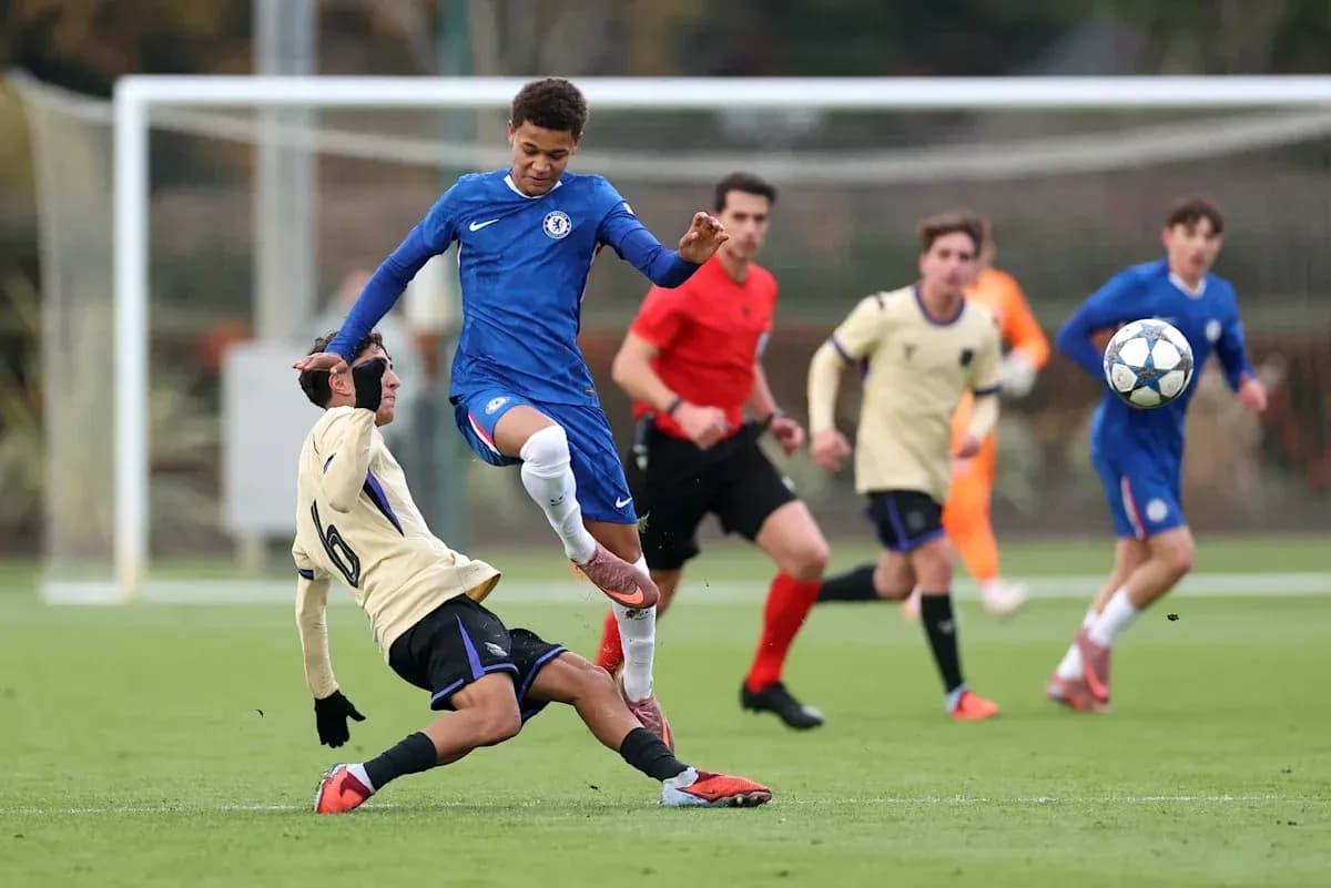 Player in blue jumps over opponent during match Player in blue jumps over opponent during match