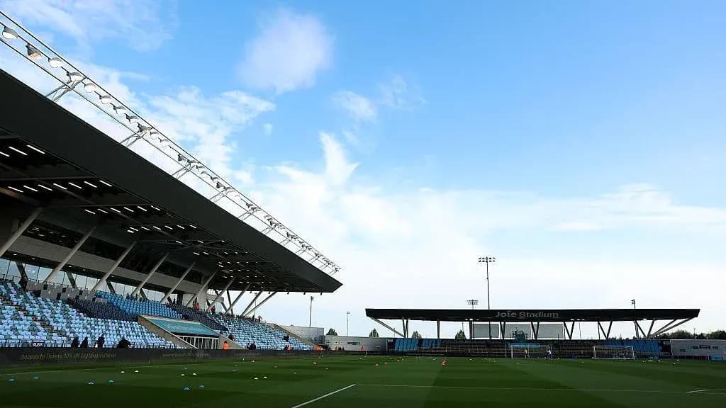 Joie Stadium with empty stands and blue sky Joie Stadium with empty stands and blue sky