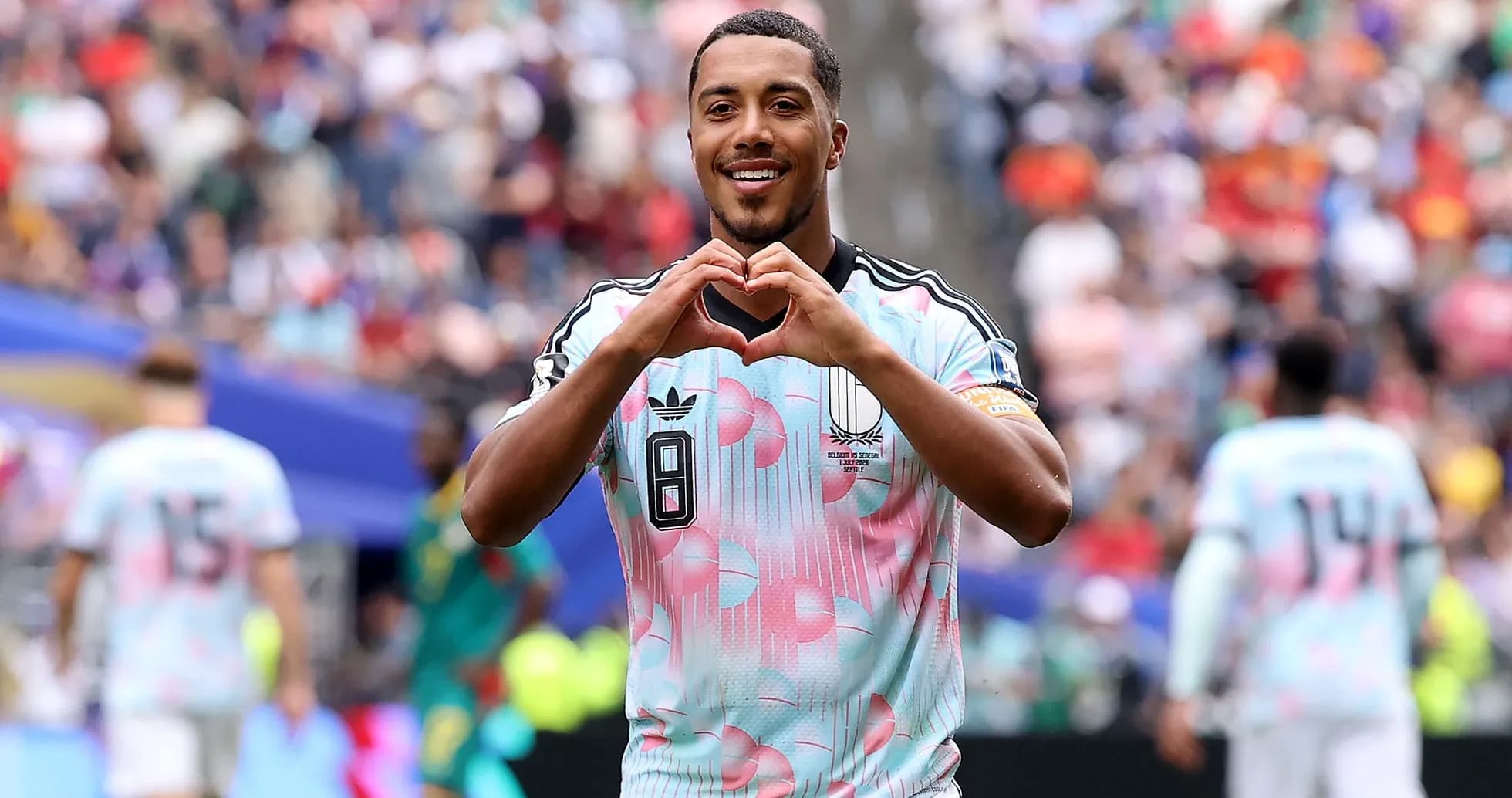 Player celebrating by making heart gesture on field Player celebrating by making heart gesture on field
