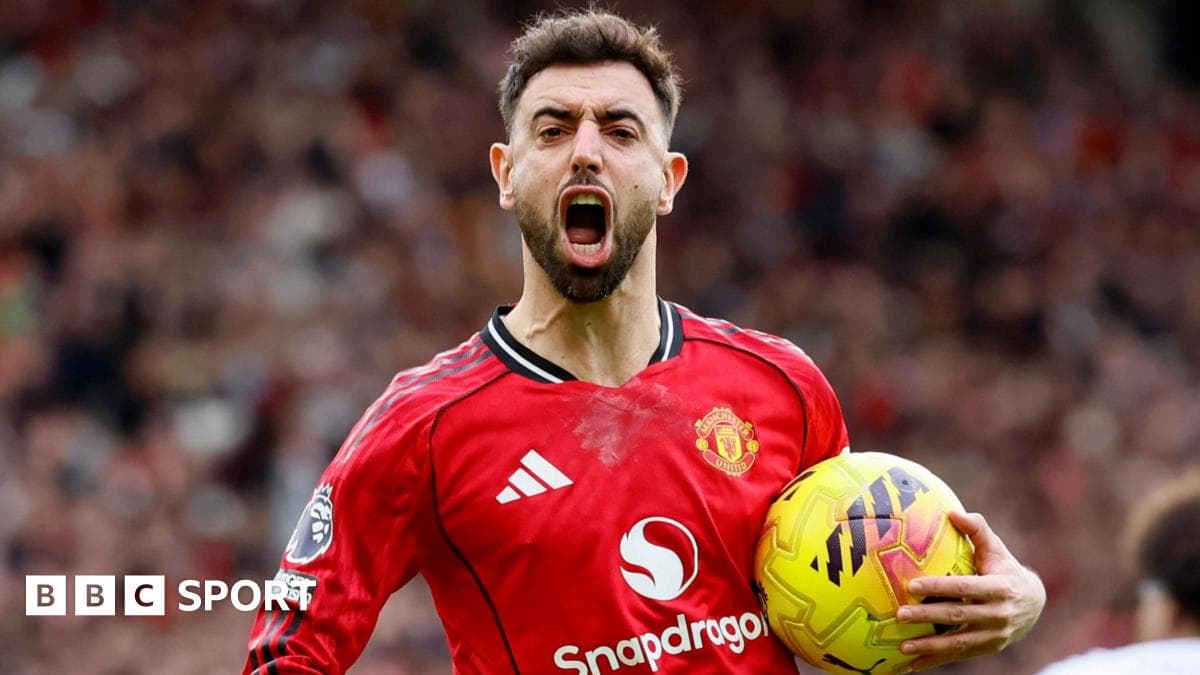 Player celebrating with ball after scoring goal Player celebrating with ball after scoring goal