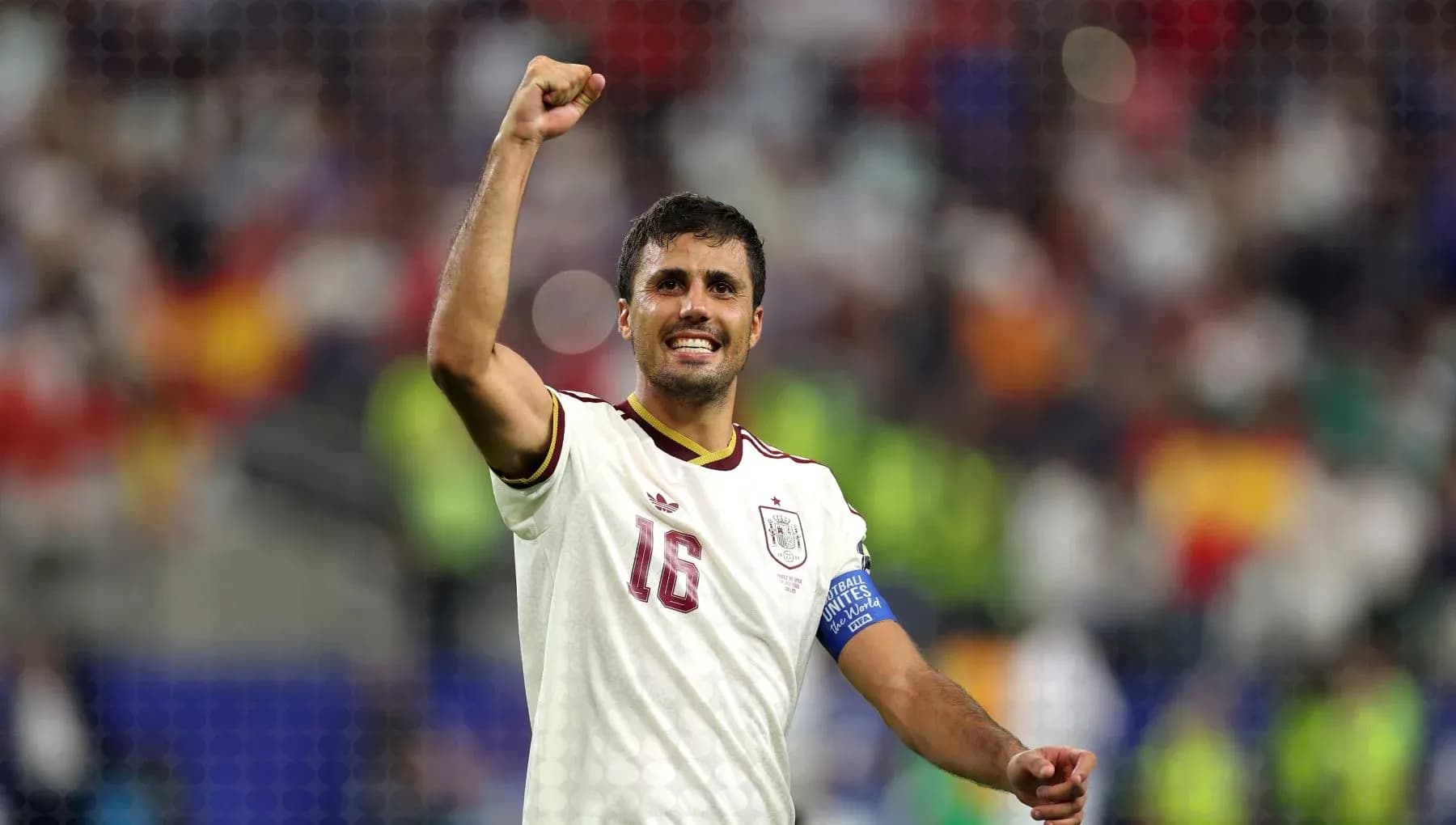 Player celebrating victory with raised fist and smile Player celebrating victory with raised fist and smile