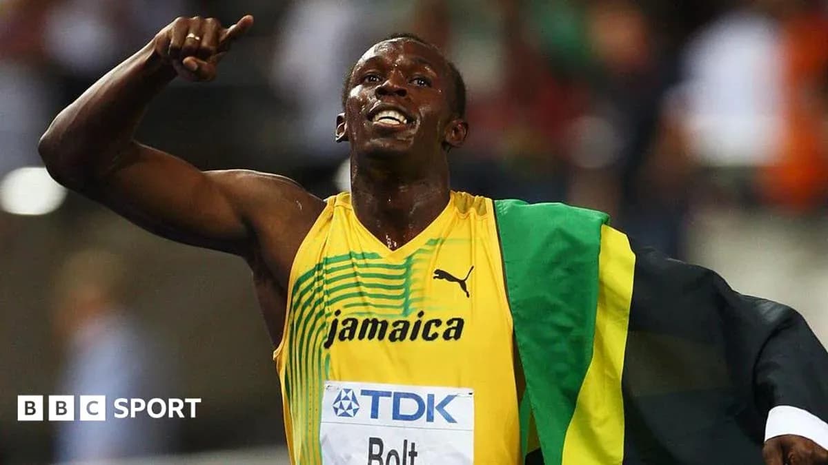 Athlete celebrating victory with Jamaican flag Athlete celebrating victory with Jamaican flag