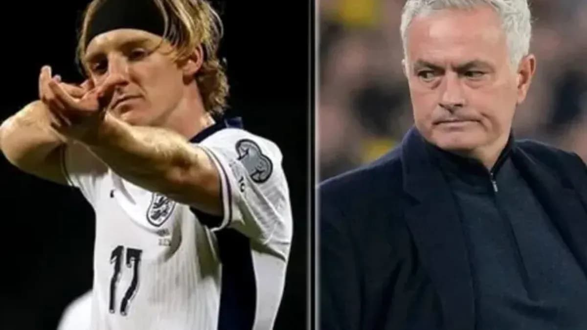 Player celebrating goal alongside manager during match Player celebrating goal alongside manager during match