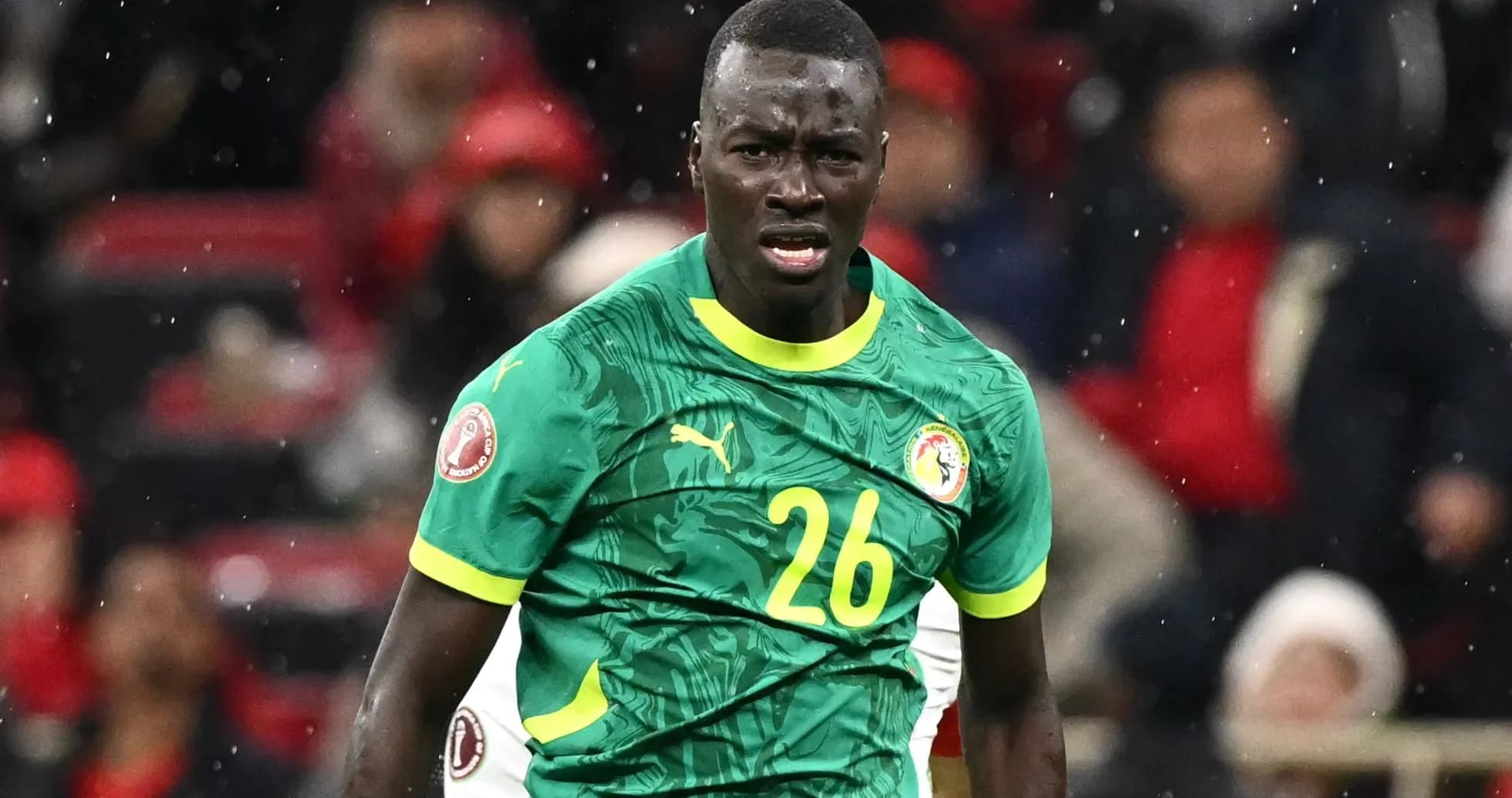 Player in green jersey during match action Player in green jersey during match action