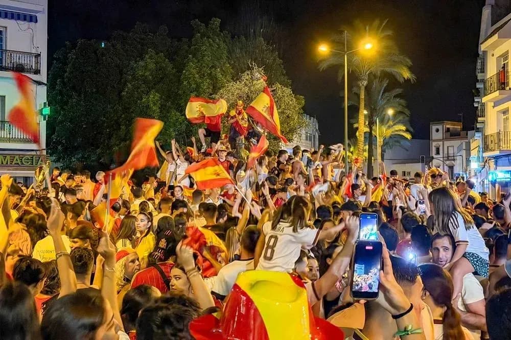 Crowd celebrating with flags in a night celebration Crowd celebrating with flags in a night celebration