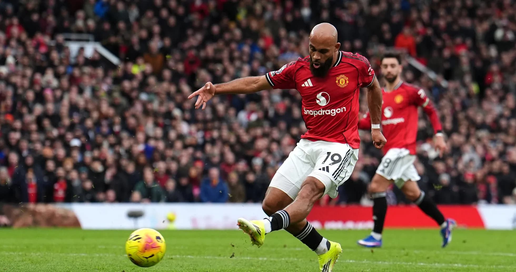 Player taking a shot during Manchester derby Player taking a shot during Manchester derby