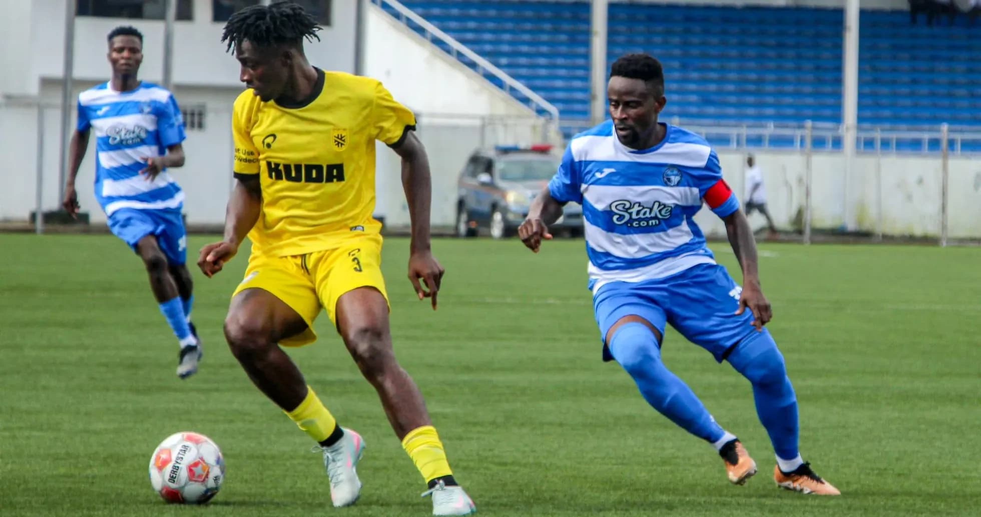 Kano Pillars player dribbling against Enyimba Kano Pillars player dribbling against Enyimba
