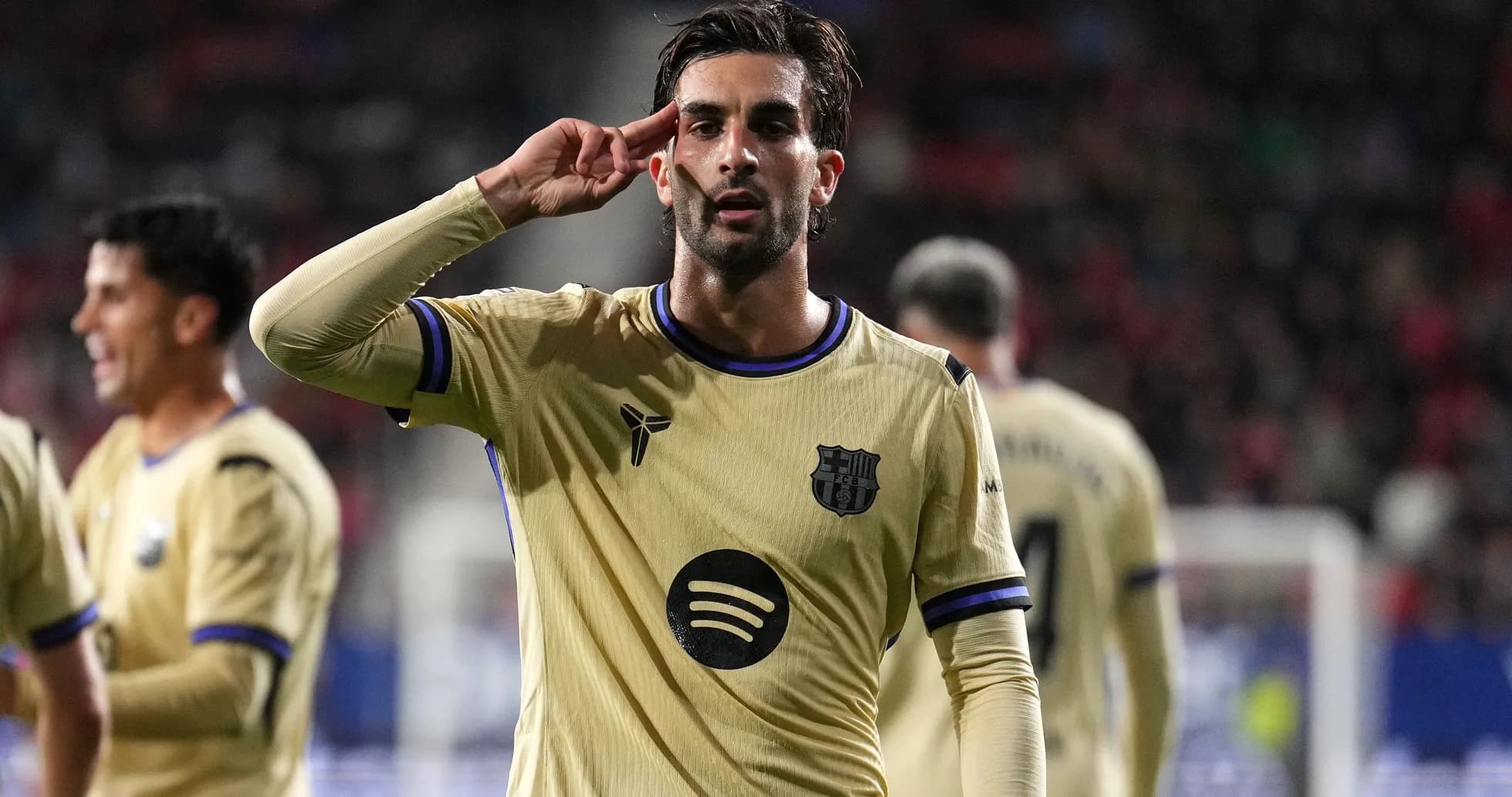 Player celebrating with a salute gesture on field Player celebrating with a salute gesture on field