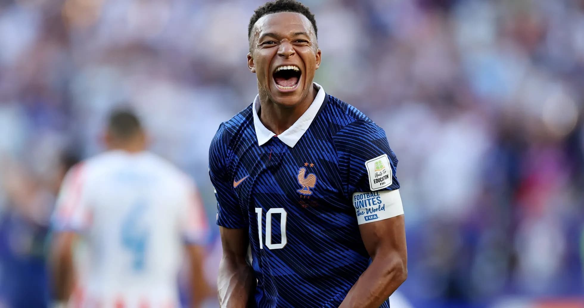 Player celebrating after scoring a goal for France Player celebrating after scoring a goal for France
