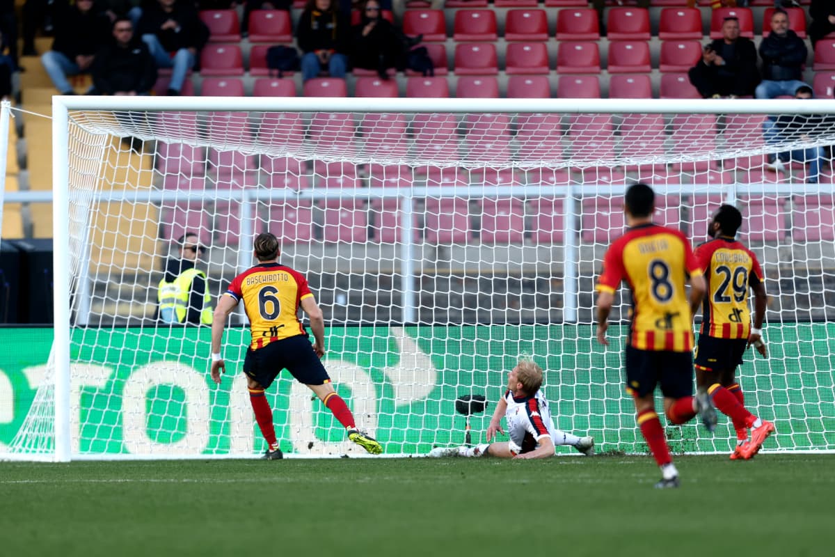 Goalkeeper saving a shot during Lecce vs Genoa match Goalkeeper saving a shot during Lecce vs Genoa match