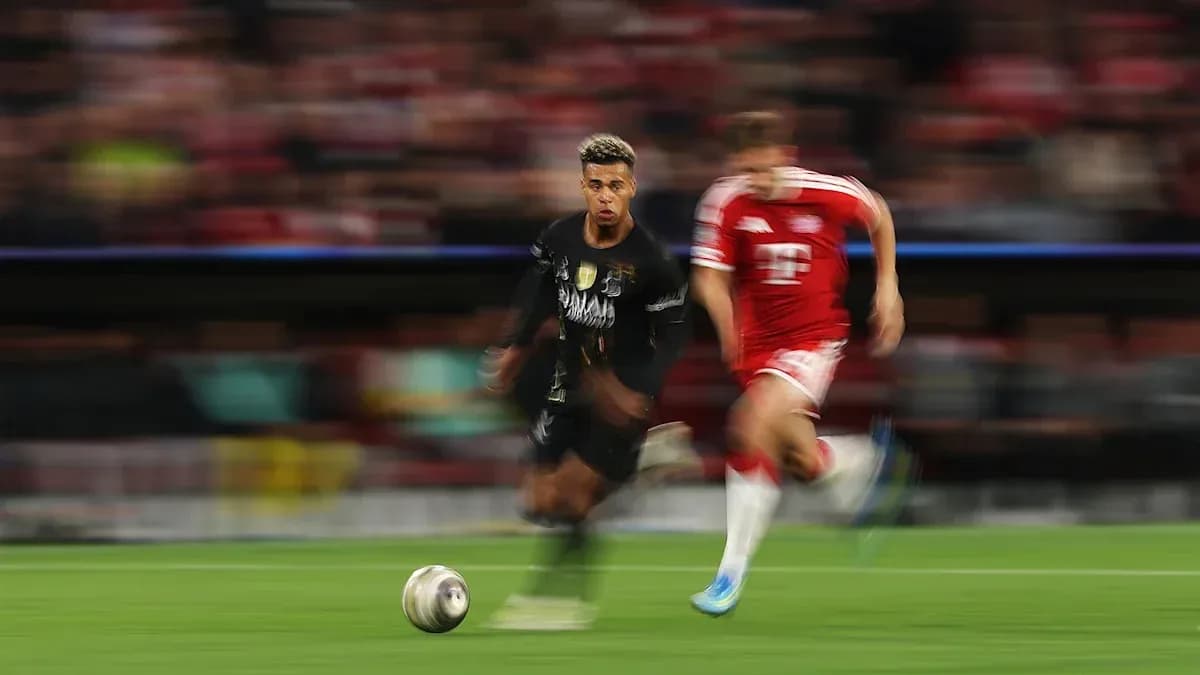 Player running with ball during intense match action Player running with ball during intense match action
