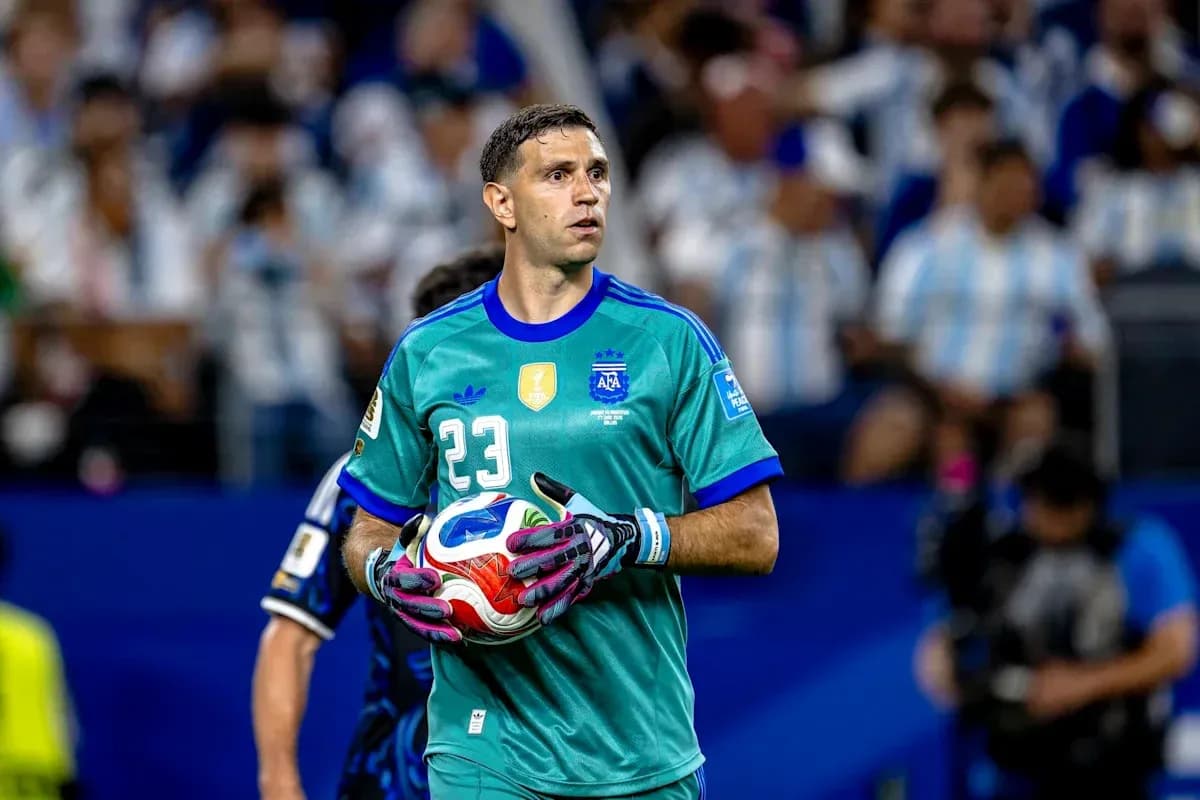 Goalkeeper in teal uniform holding a soccer ball Goalkeeper in teal uniform holding a soccer ball