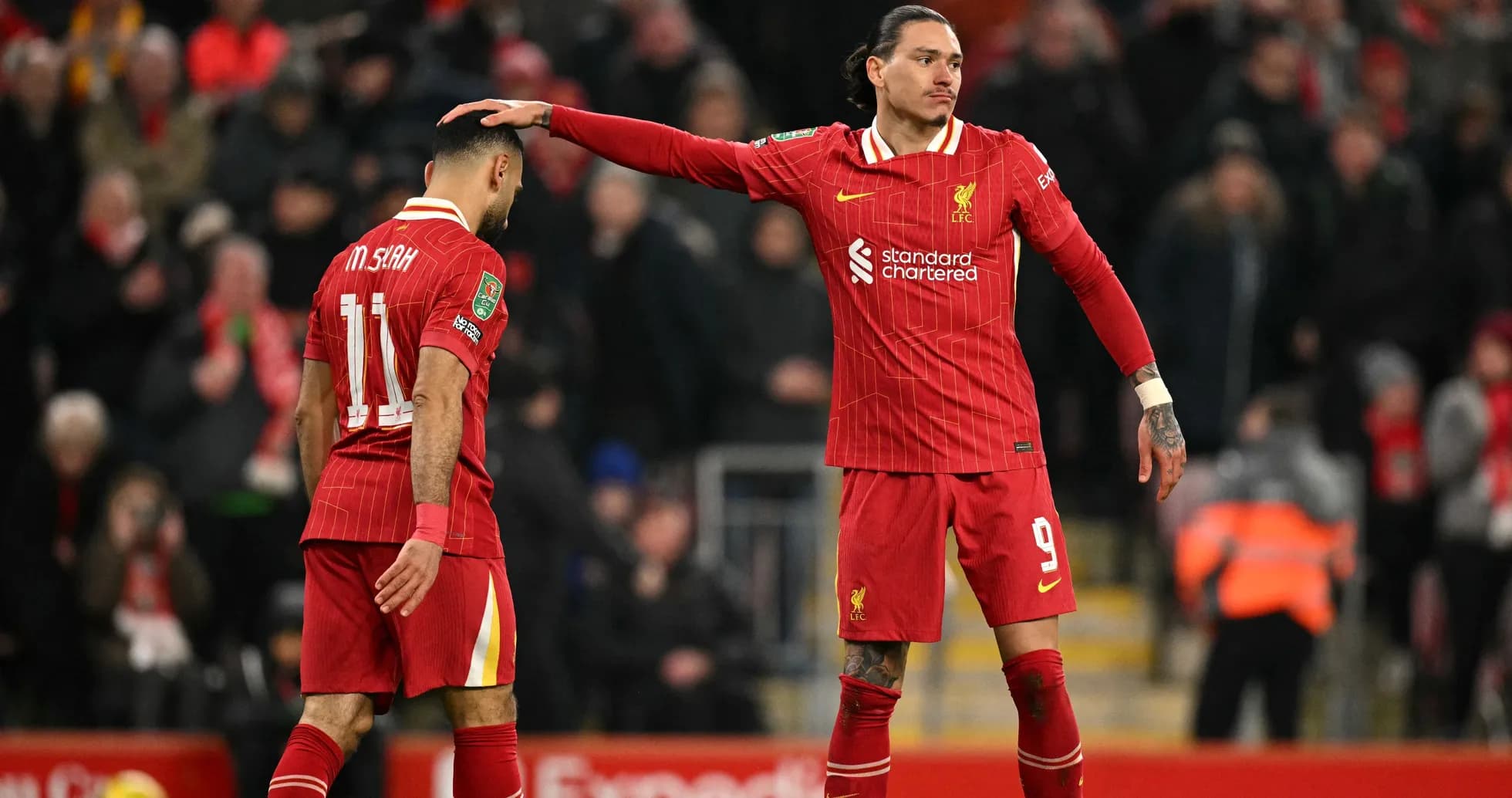 Liverpool players discussing during a match Liverpool players discussing during a match