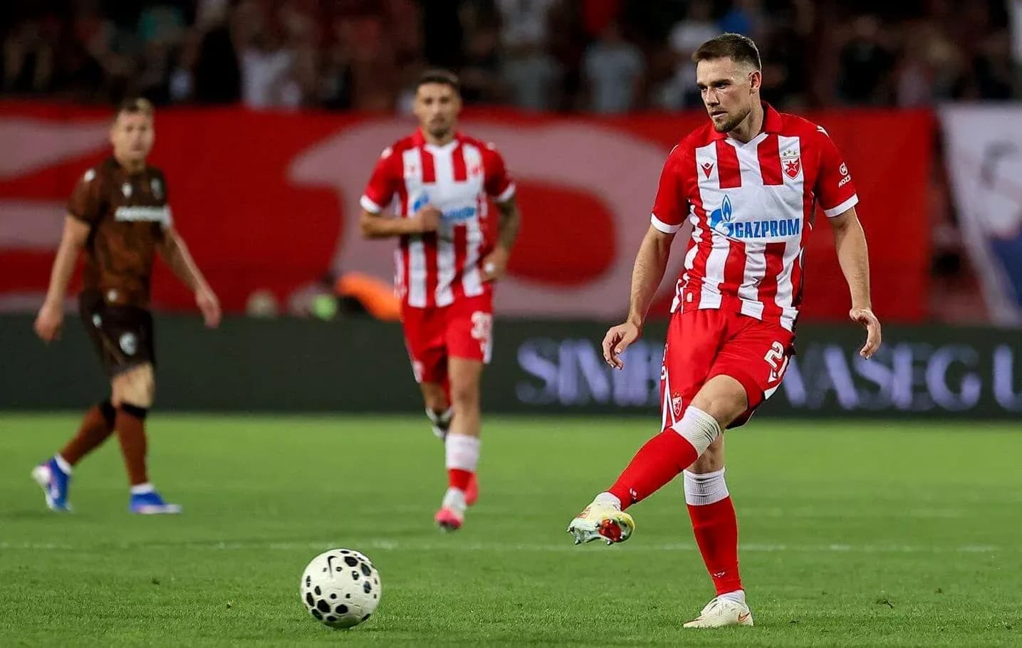 FK Crvena Zvezda player preparing to kick ball FK Crvena Zvezda player preparing to kick ball